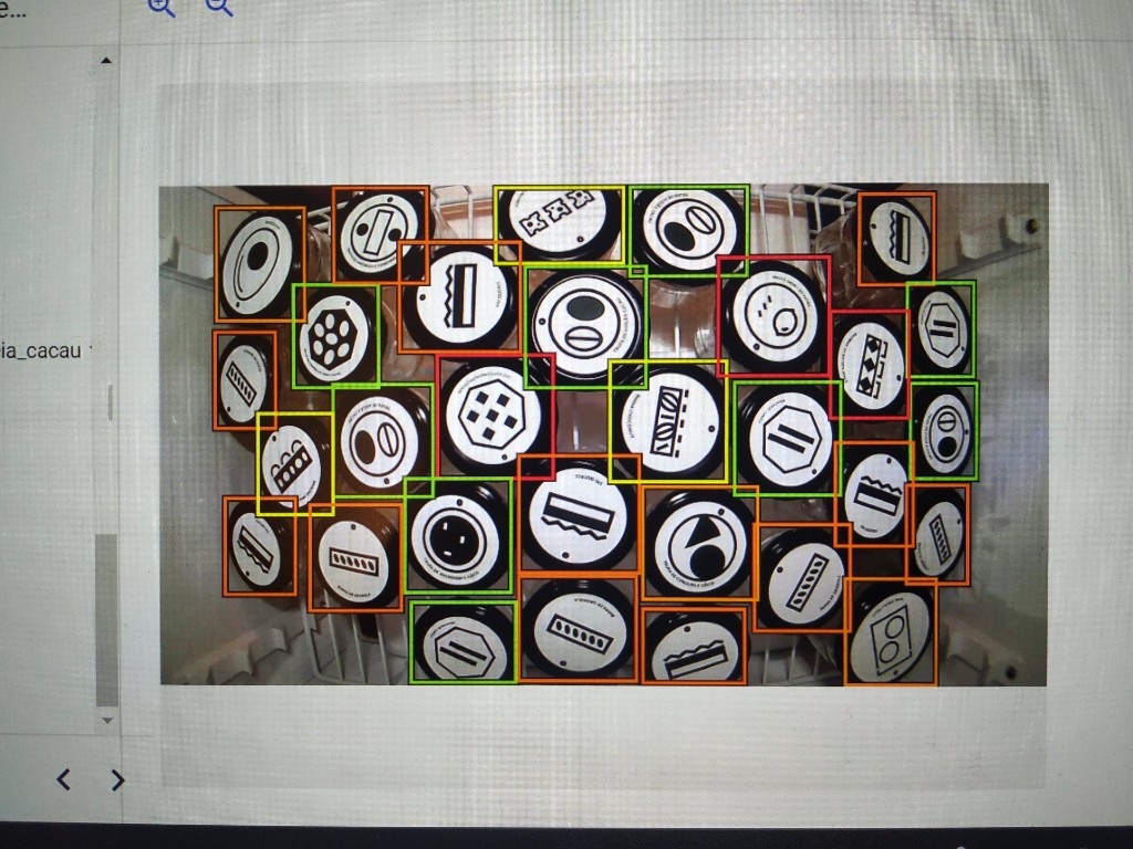 Computer vision output with bounding boxes detected around jar lids